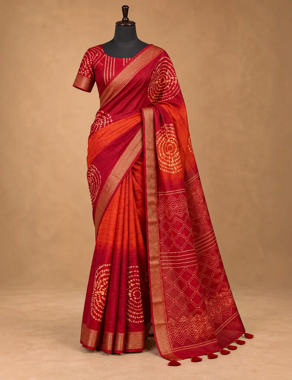 House Of Paramya maroon and orange ombre viscose vegan silk saree with gold zari border and bandhani print motifs.