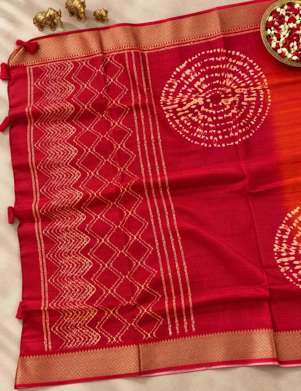 House Of Paramya maroon and orange ombre viscose vegan silk saree with gold zari border and bandhani print details.