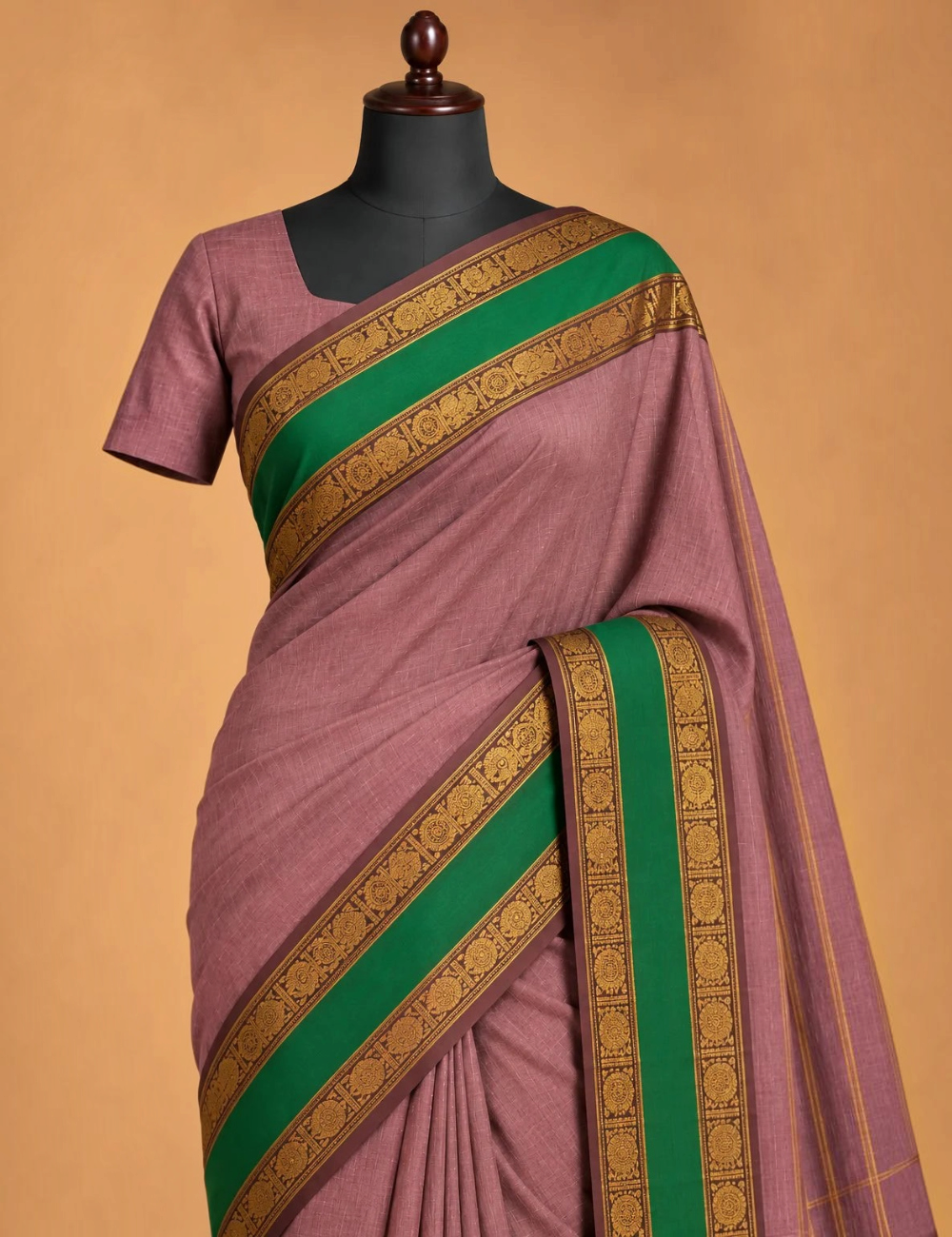 House Of Paramya dusty mauve Chettinad cotton saree with a green pallu and brown gold zari peacock border on a mannequin