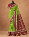 House Of Paramya moss green and brown Mysore silk saree with gold zari elephant border on a mannequin