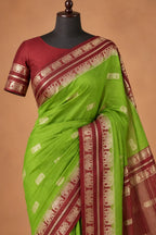 House Of Paramya moss green Mysore silk saree with brown elephant motif border and matching blouse on a mannequin