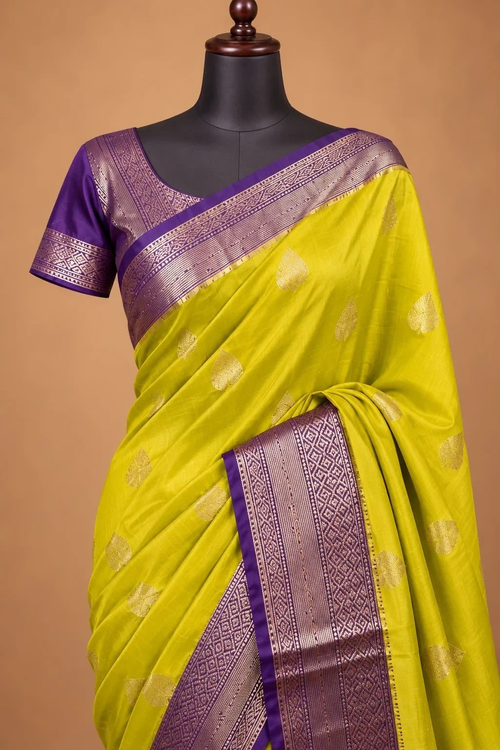 House Of Paramya mustard yellow Assam silk saree with gold leaf buti motifs and a purple border with geometric weave.