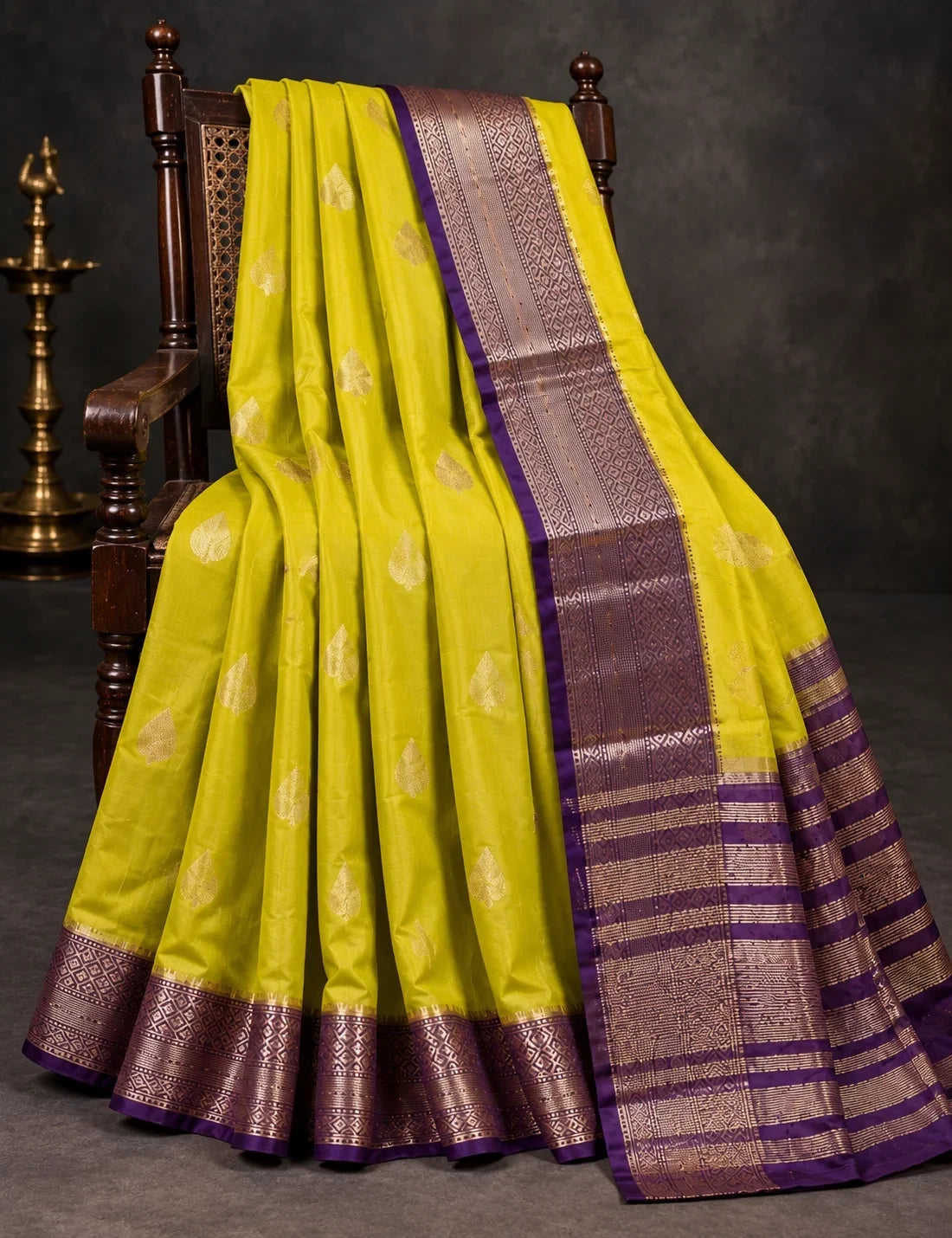 House Of Paramya mustard yellow Assam silk saree with woven gold leaf motifs and a purple border with metallic weave.