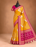 House Of Paramya mustard and magenta vegan silk saree with ikat diamond print and woven zari border on a mannequin