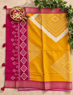 House Of Paramya mustard and magenta vegan silk saree with ikat diamond print and woven zari border with tassels.