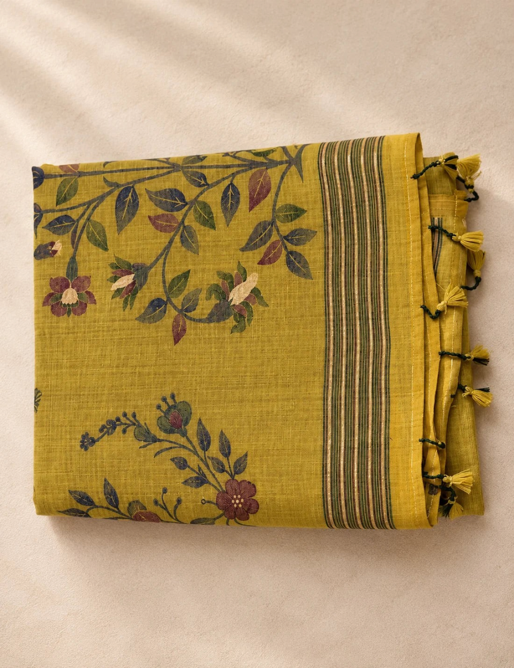 House Of Paramya mustard olive Munga cotton saree with woven floral motifs, zari striped pallu, and decorative tassels.