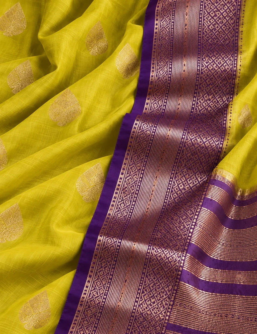 House Of Paramya mustard yellow Assam silk saree with gold leaf buti motifs and a purple border with metallic weave.