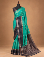 House Of Paramya crepe silk saree in turquoise green and navy blue with intricate gold zari border and striped pattern