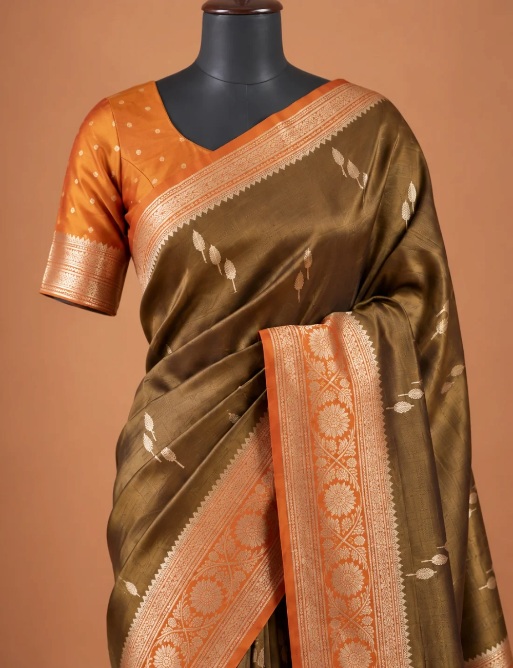 House Of Paramya olive gold tissue silk saree with nature-inspired motifs and a floral zari border on a mannequin