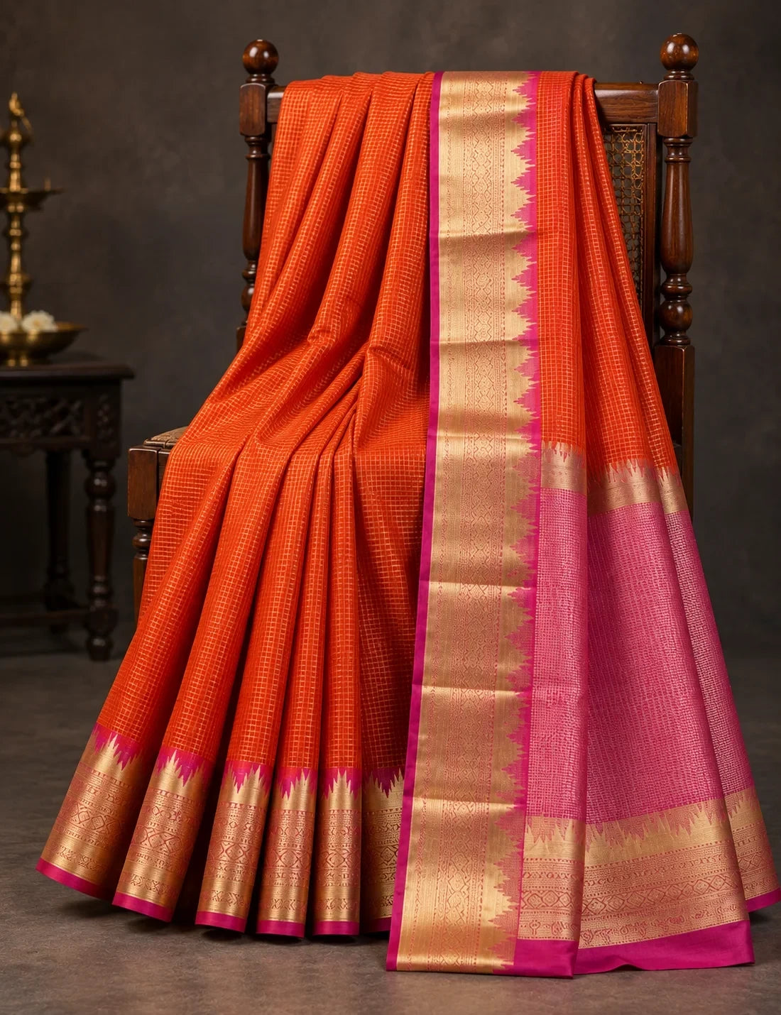 House Of Paramya orange Mysore crepe silk saree with gold zari temple border, pink zigzag edge, and pink pallu.