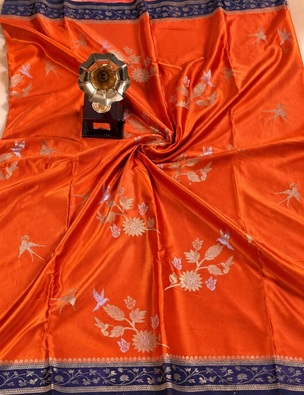 House Of Paramya orange satin silk saree with deep purple zari border and woven floral Meenakari motifs