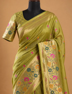 House Of Paramya parrot green Paithani silk saree with multicolor floral zari pallu and gold border on a mannequin