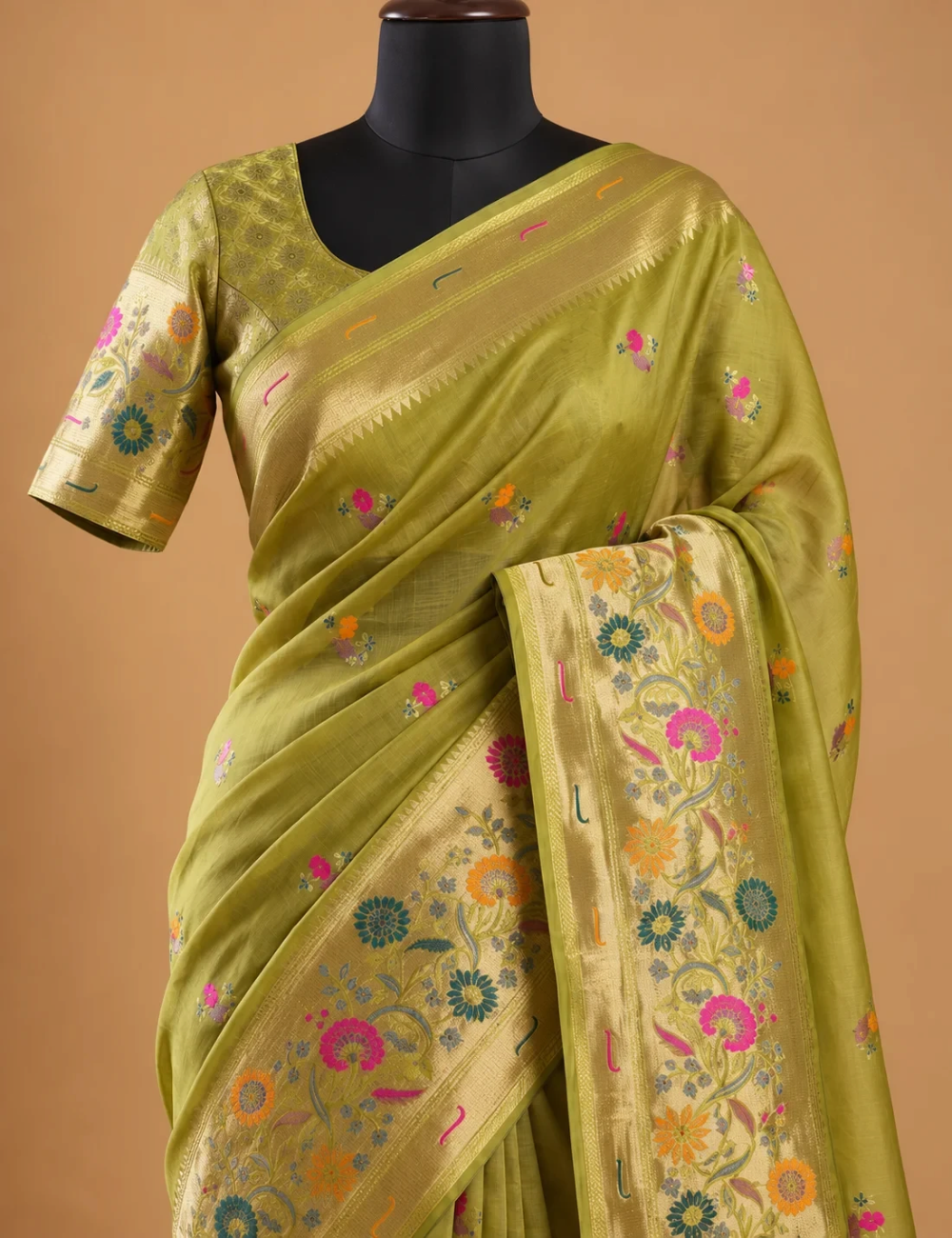 House Of Paramya parrot green Paithani silk saree with multicolor floral zari pallu and gold border on a mannequin
