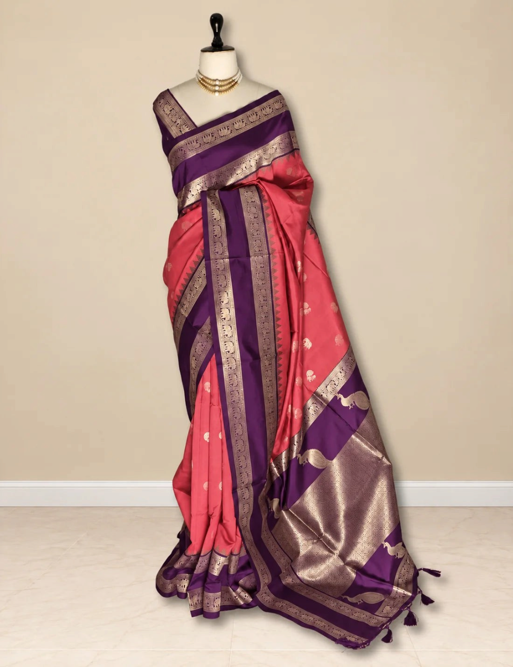 House Of Paramya parrot green semi soft silk saree with navy blue elephant border and peacock zari pallu on mannequin