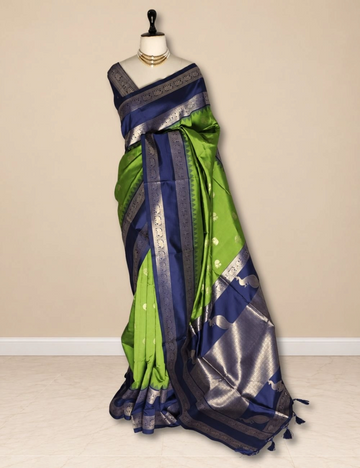 House Of Paramya parrot green semi soft silk saree with navy blue elephant border and peacock zari pallu on mannequin