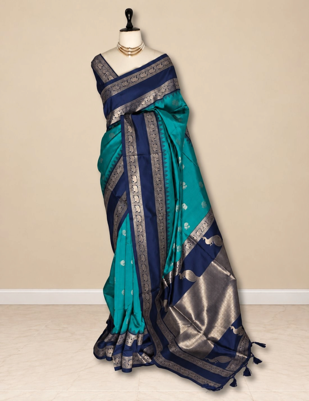 House Of Paramya parrot green semi soft silk saree with navy blue elephant border and peacock zari pallu on mannequin