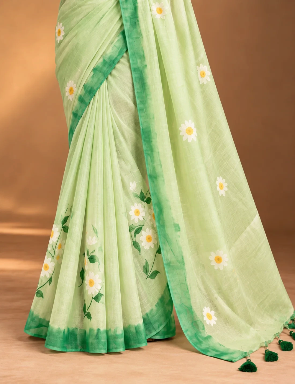 House Of Paramya pastel green linen cotton saree featuring a white and yellow daisy floral print and dark green border