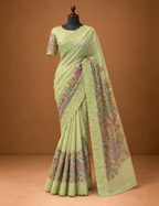 House Of Paramya pastel green Kota silk saree with digital multicolor floral print and scalloped lace border.