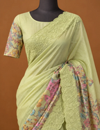 House Of Paramya pastel green Kota silk saree featuring digital multicolor prints and a scalloped lace border.
