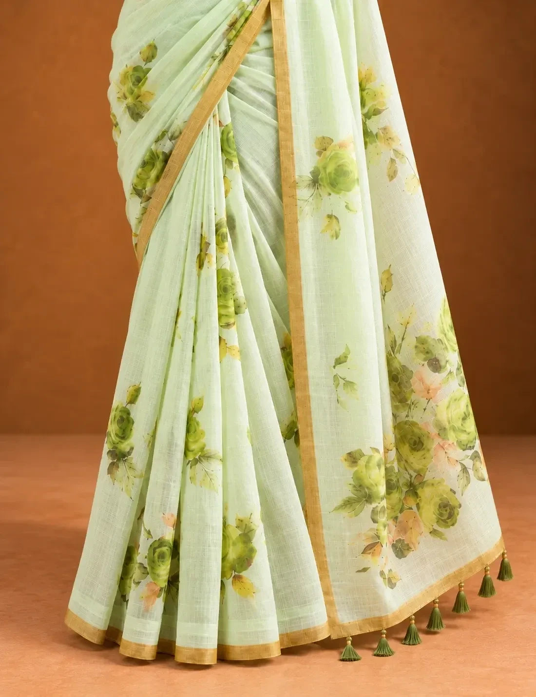 House Of Paramya pastel green linen cotton saree featuring a tonal monochrome rose print and a minimal borderless edge