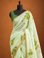 House Of Paramya pastel green linen cotton saree featuring a tonal monochrome rose print and a minimal borderless edge.
