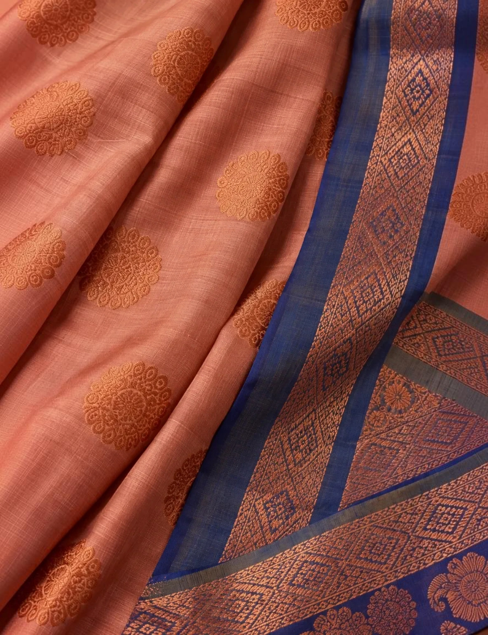 House Of Paramya soft silk saree in sapota peach with royal blue border and copper zari floral motifs