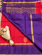House Of Paramya pink Kanchipuram silk saree with purple zari border and pallu, featuring elegant gold motifs.