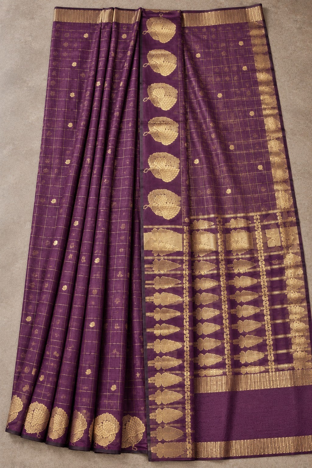 House Of Paramya plum raw silk saree with gold zari checks and floral motifs for festive occasions.