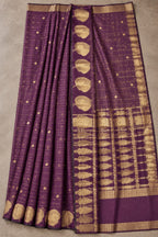 House Of Paramya plum raw silk saree with gold zari checks and floral motifs for festive occasions.