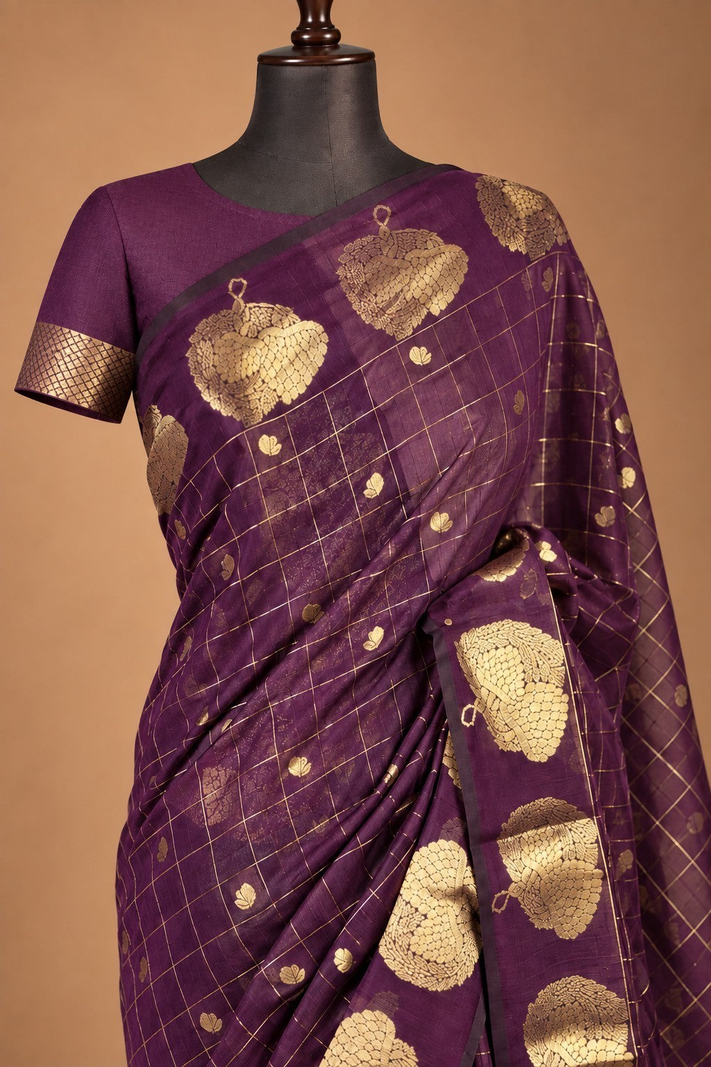 House Of Paramya plum raw silk saree with gold zari checks and floral motifs on a mannequin