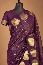 House Of Paramya plum raw silk saree with gold zari checks and floral motifs on a mannequin