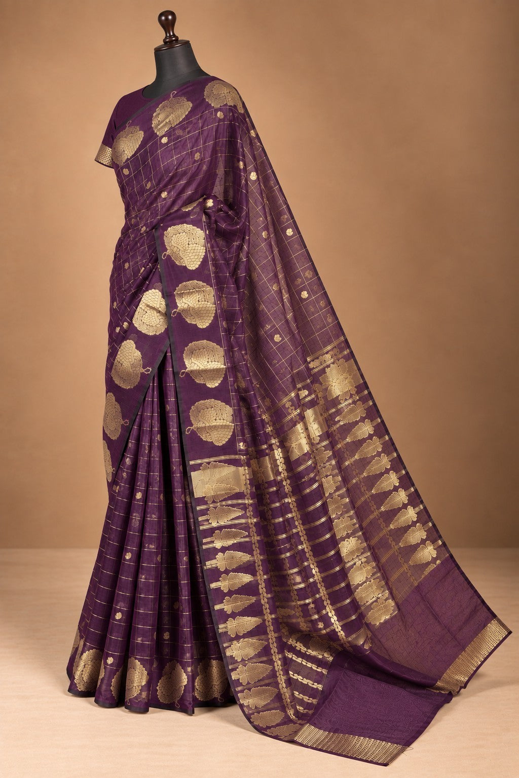 House Of Paramya plum raw silk saree with gold zari checks and intricate floral leaf motifs on a mannequin