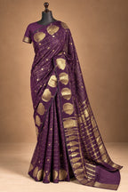 House Of Paramya plum raw silk saree featuring gold zari checks and intricate floral butta motifs on a mannequin.