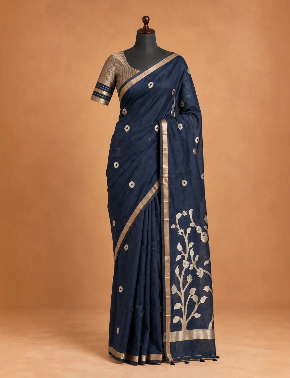 House Of Paramya plum raw tussar cotton saree featuring gold zari floral pallu, zari buttis, and a striped blouse.
