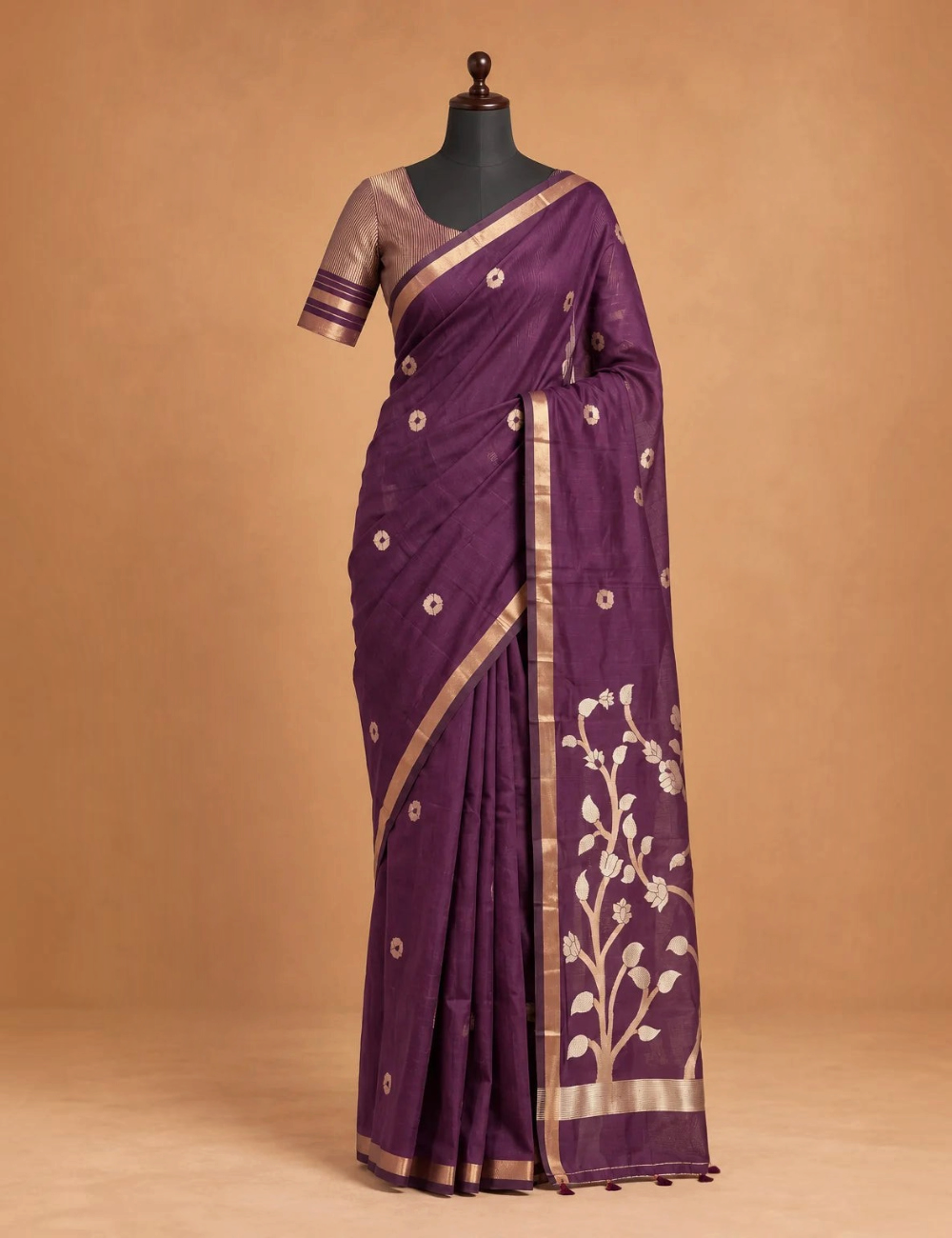 House Of Paramya plum raw tussar cotton saree with gold zari floral pallu, buttis, and a striped blouse piece.