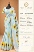 House Of Paramya powder blue linen cotton saree with vibrant sunflower prints and a delicate gold zari border.