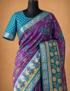 House Of Paramya purple linen silk saree with pen Kalamkari folk art, teal zari border, and matching printed blouse.