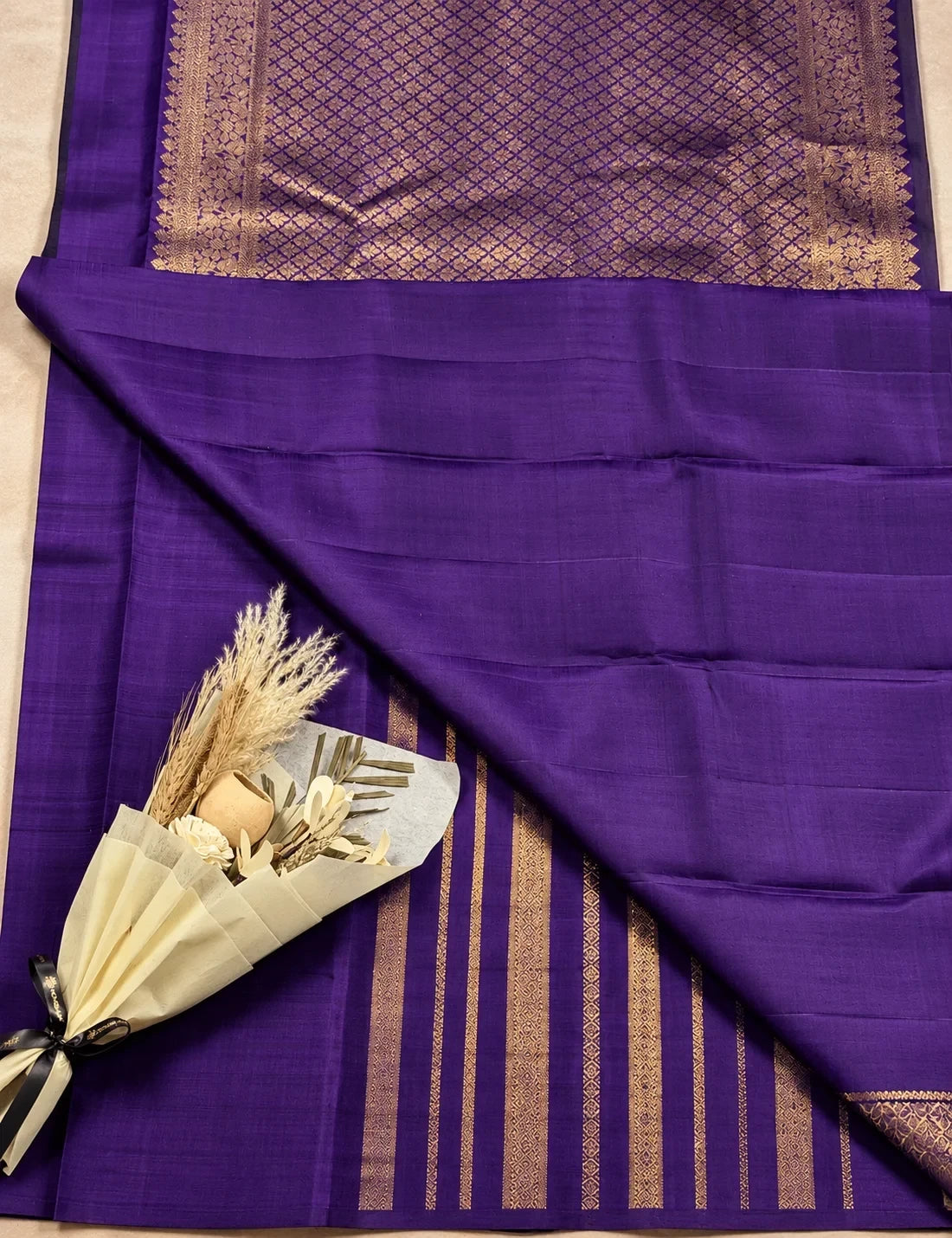 House Of Paramya dark purple pure Kanchipuram silk saree with intricate silver zari weaving and floral bouquet