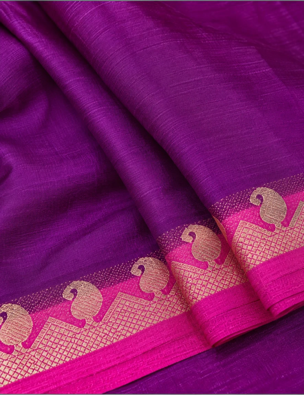 House Of Paramya purple Mysore silk saree featuring a plain body and a pink contrast zari border with peacock motifs.