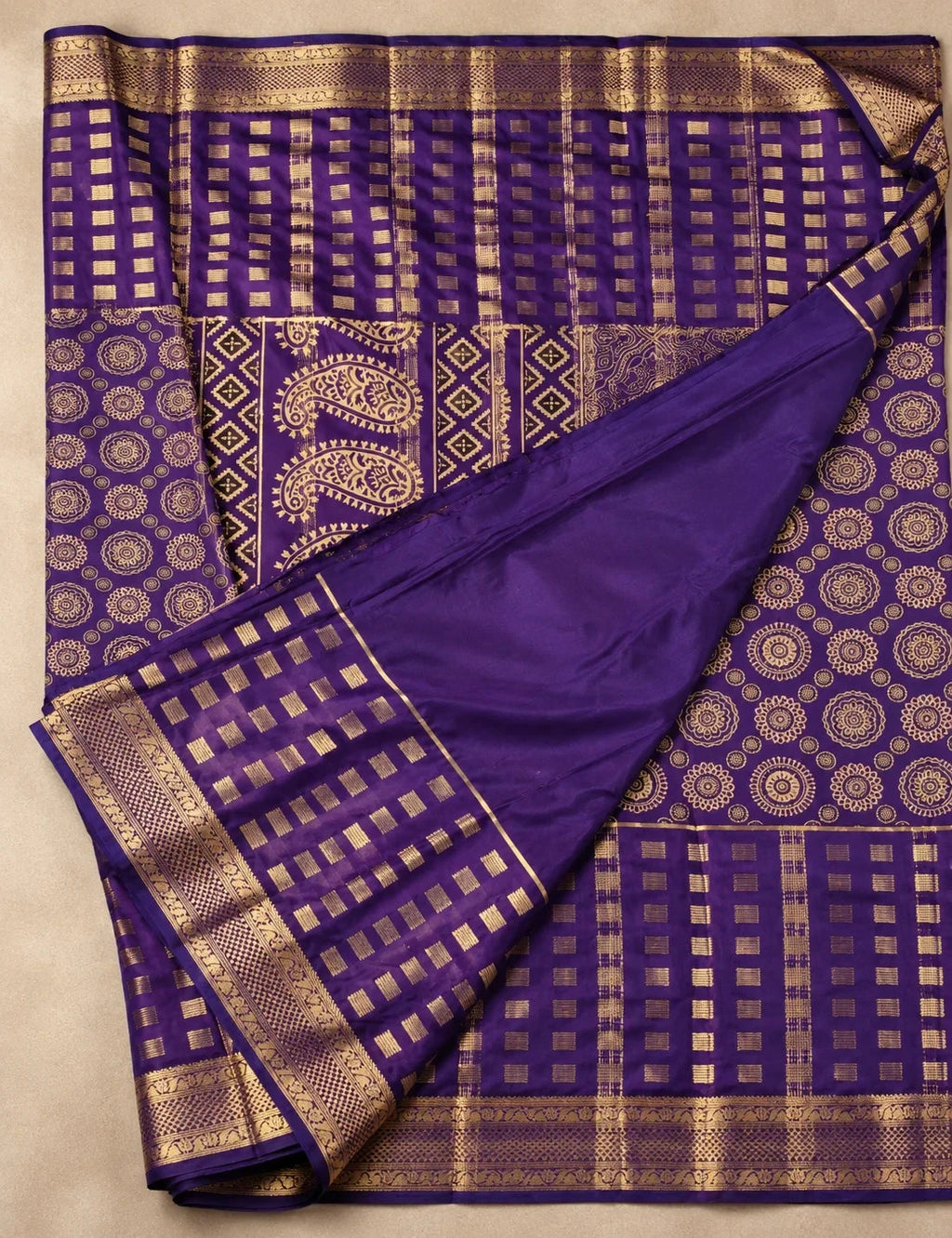 House Of Paramya deep purple Mysore crepe silk saree with gold woven checks, mandala motifs, and a zari paisley pallu.
