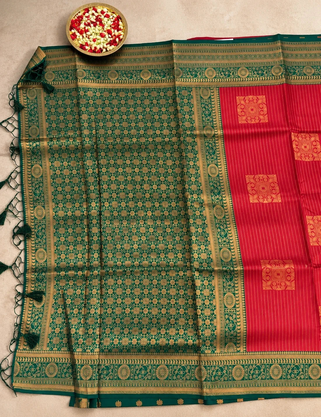 House Of Paramya red semi Kanchipuram silk saree with gold floral jaal and a contrast bottle green striped pallu.