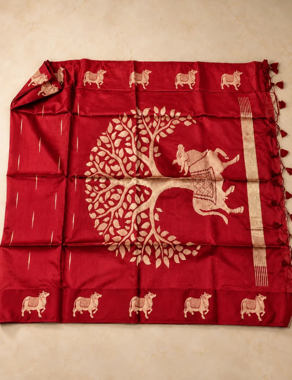 House Of Paramya red raw tussar silk saree featuring large woven gold zari Pichwai cow and tree motifs on the pallu