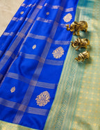House Of Paramya royal blue semi Kanjivaram silk saree with gold checkered weave, floral butis, and turquoise border