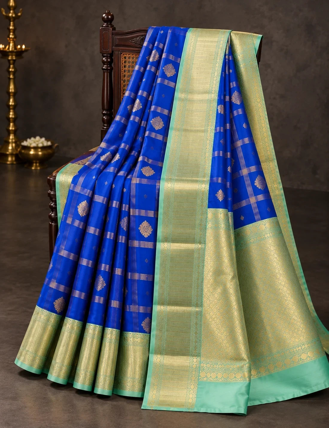 House Of Paramya royal blue semi Kanjivaram silk saree with gold checkered weave, floral butis and turquoise zari border