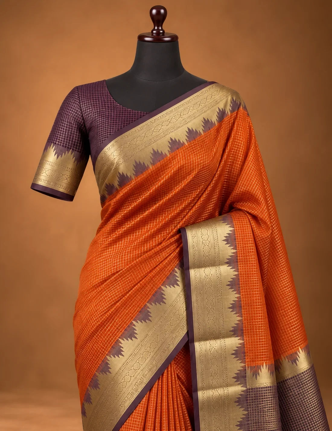 House Of Paramya rust orange Mysore crepe silk saree with a charcoal-brown pallu and gold zari scalloped temple border