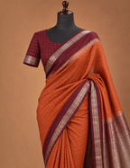 House Of Paramya rust orange Mysore silk saree with deep brown border and silver zari geometric pattern on mannequin