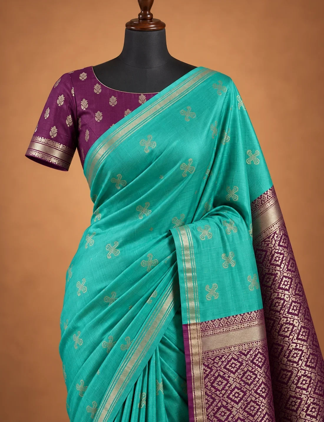 House Of Paramya light sea green Gajji silk saree with wine pallu, gold Damarukkam motifs, and floral wine blouse.