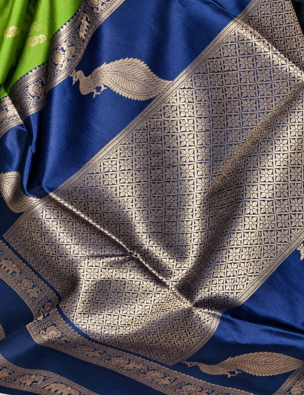 House Of Paramya parrot green and navy blue semi soft silk saree featuring a gold zari peacock pallu and border.