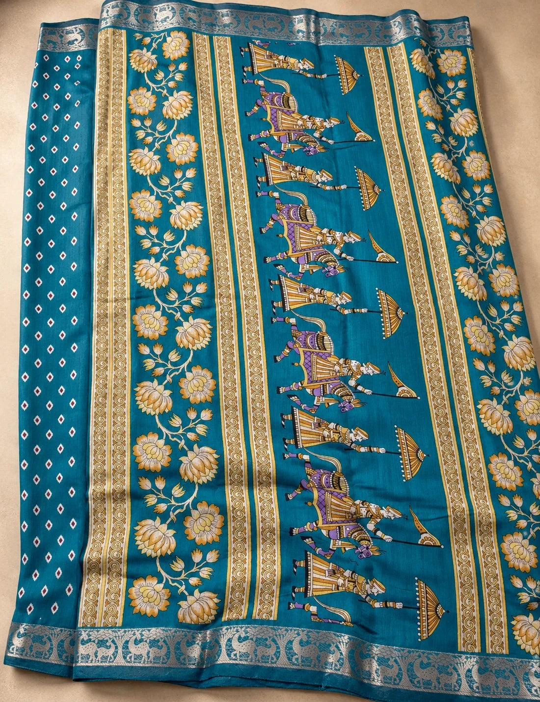 House Of Paramya teal linen silk saree with traditional pen Kalamkari folk art motifs and a metallic zari border
