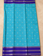 House Of Paramya turquoise Assam cotton saree featuring gold buti weave and a contrast purple floral-arrow border.